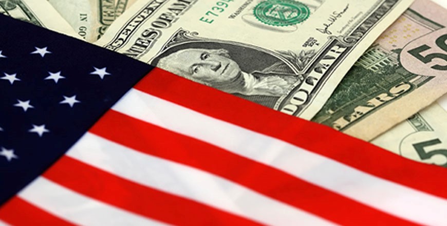 United States currency behind the United States flag.