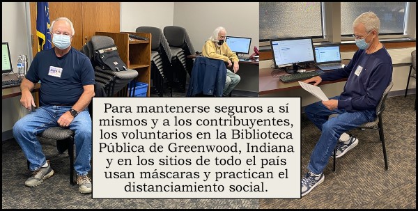 Volunteers with masks at workstations wih Spanish quote