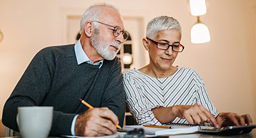 older couple doing taxes homepage