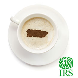 Coffee cup and plate; coffee foam has design of map of Puerto Rico in brown; lower right corner IRS logo in green