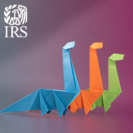 Three dinosaurs and a white IRS logo. 
